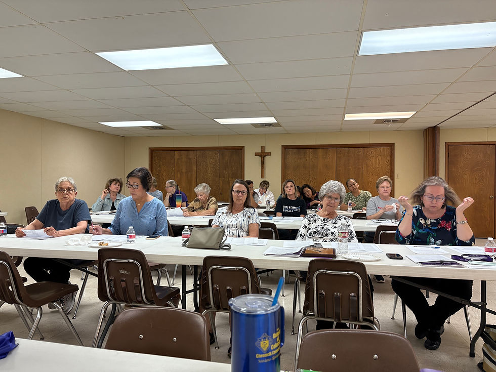 Members at monthly meeting