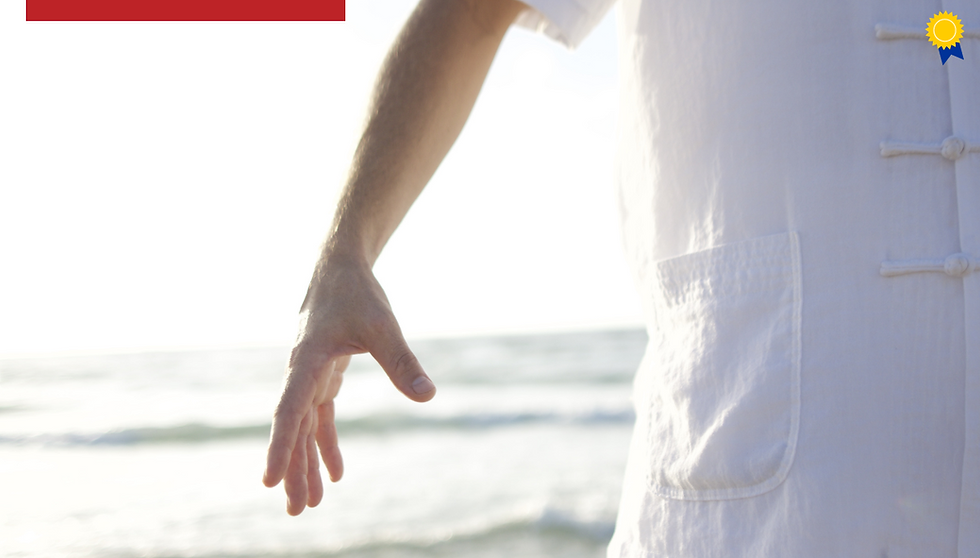 A person is standing with their right arm raised