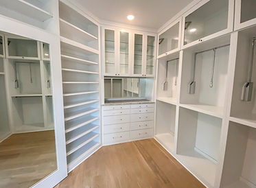 Custom white cabinetry for the closet