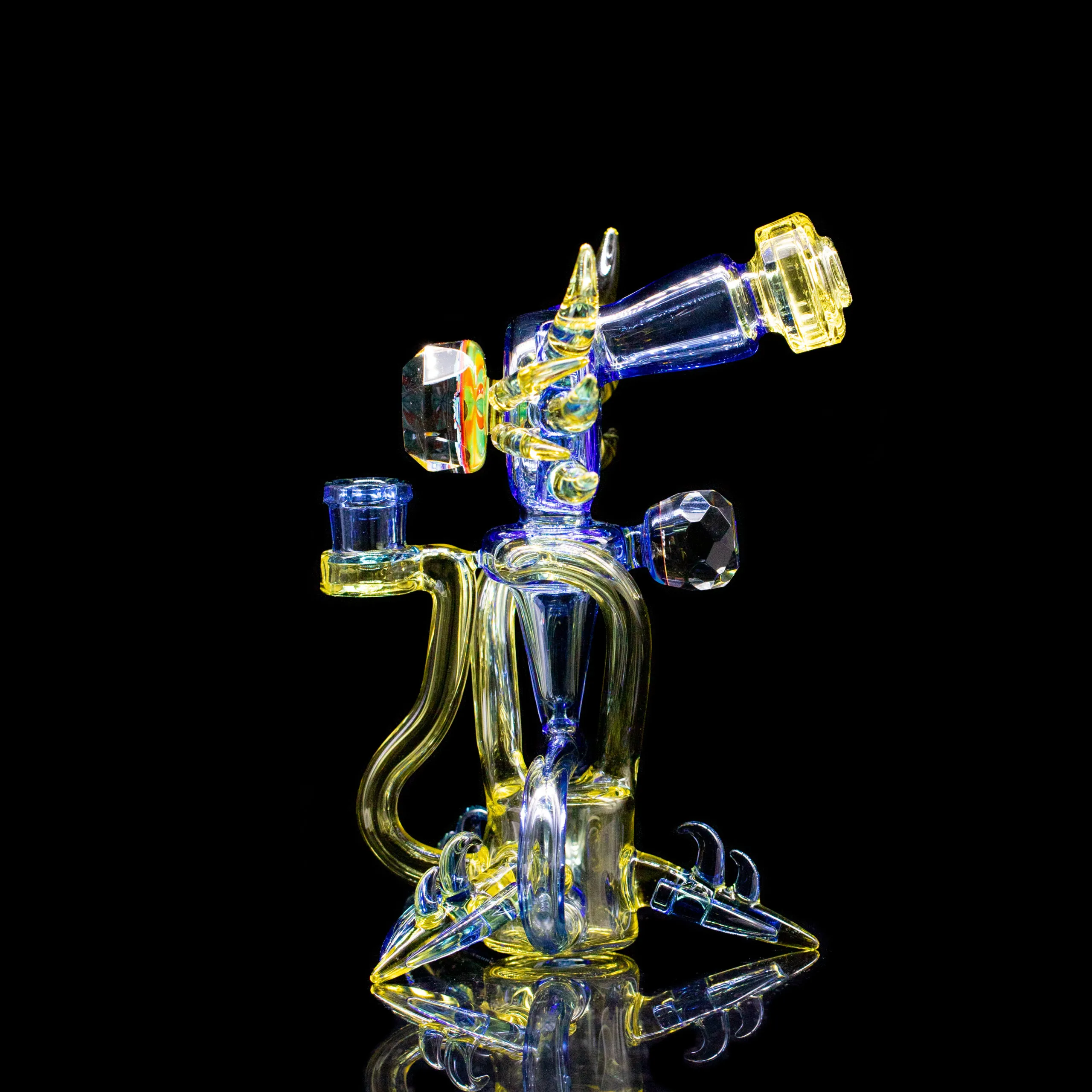 Showcase of heady glass pieces at Smokerz Land Smoke Shop, highlighting artisanal craftsmanship, intricate designs, and vibrant color patterns unique to each piece.