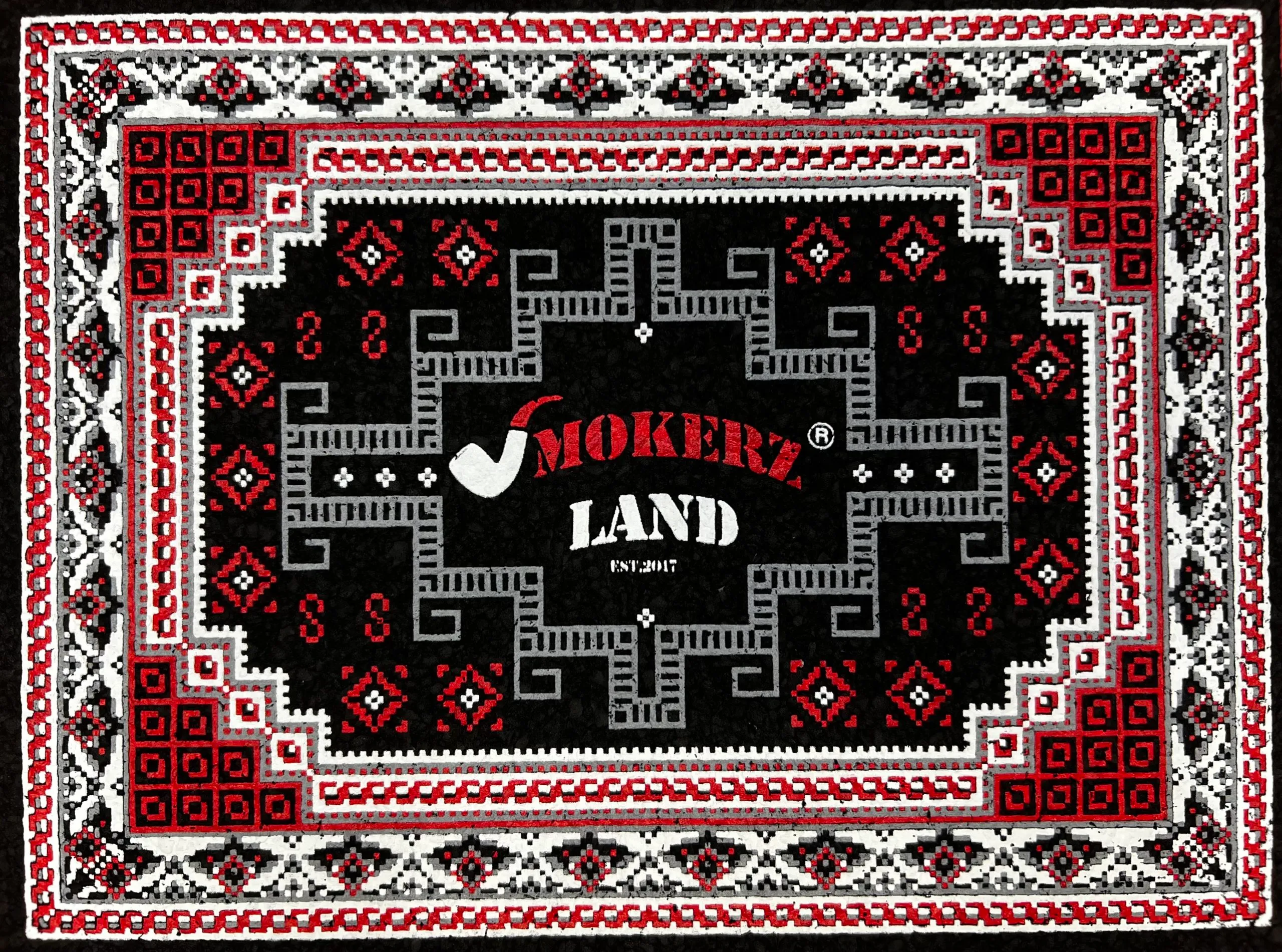 Assortment of apparel and mats from Smokerz Land Smoke Shop, showcasing branded clothing and custom-designed mats with vibrant graphics and smoking culture motifs.