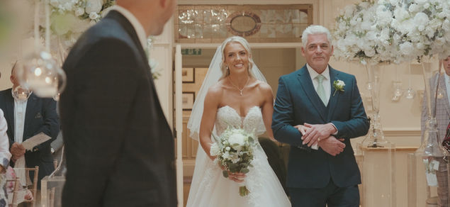 Father walking bride down the aisle during wedding ceremony at Ashfield House Lancashire