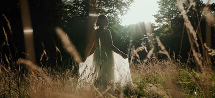 Bride in golden evening light in the gardens at Ashfield House Lancashire