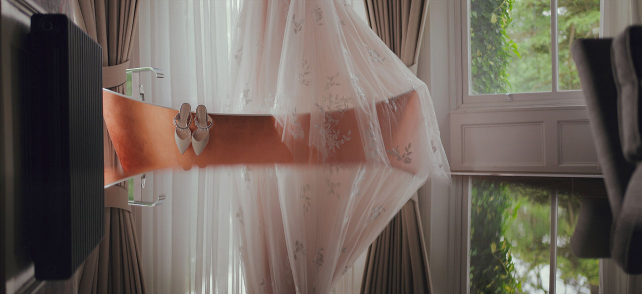 bridal dress and shoes on copper bath