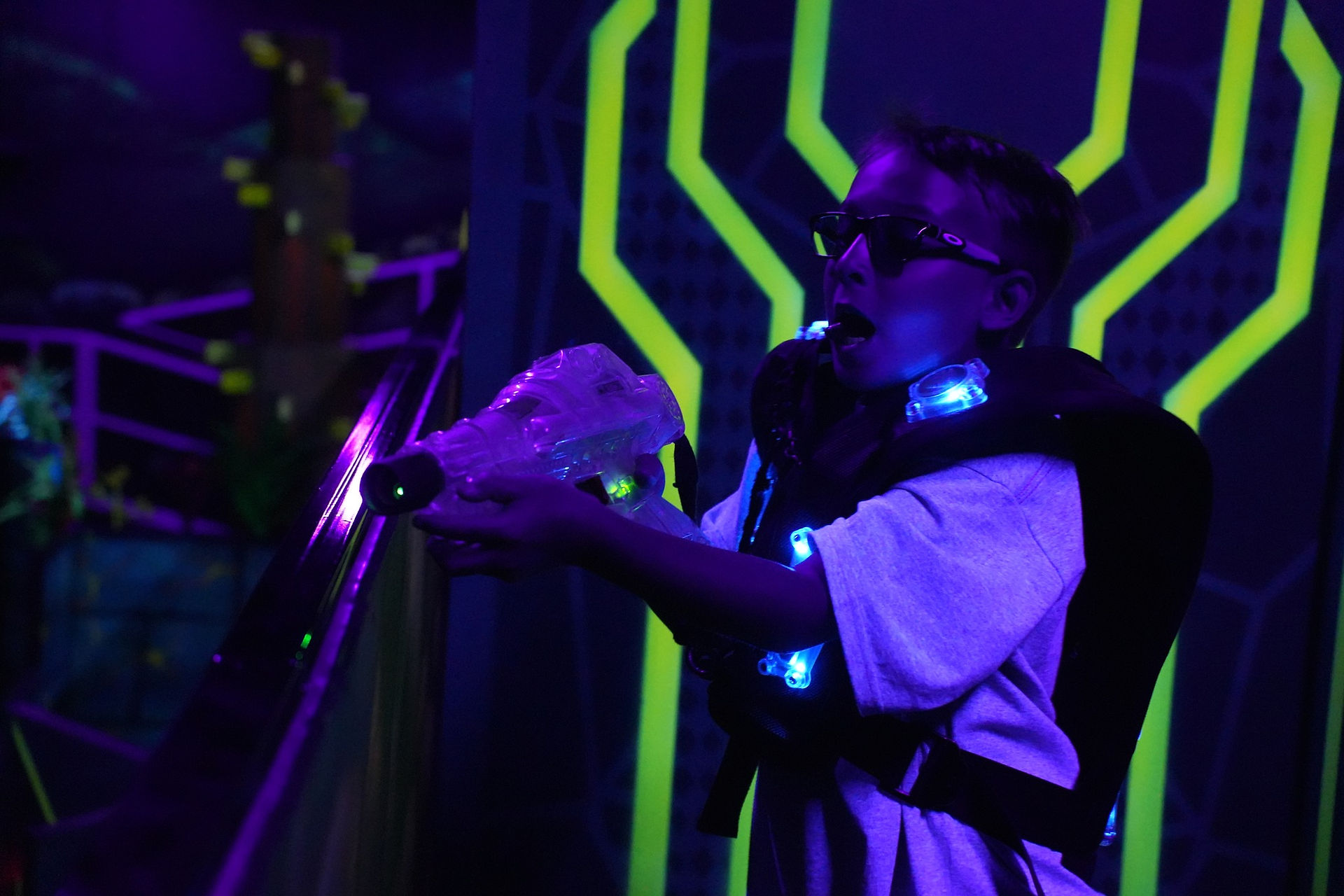 little boys playing laser tag at the fun lab