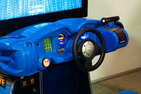 Blue racing arcade game setup at Bounce City’s arcade area.
