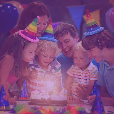 Kids enjoying a colorful galaxy-themed birthday party with lights and interactive play at Galaxy Zone indoor playground