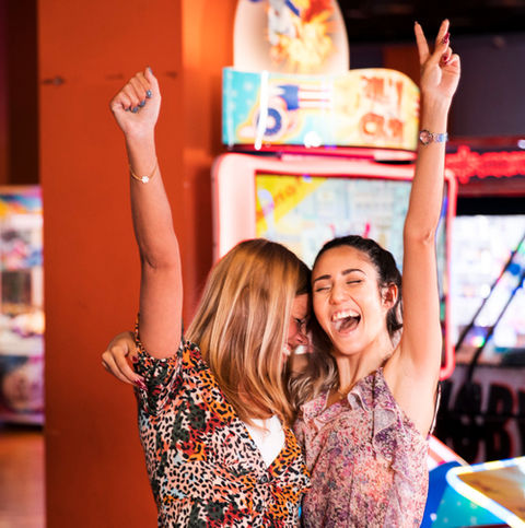Friends celebrating and posing for a selfie at The Fun Lab in Blaine, MN.