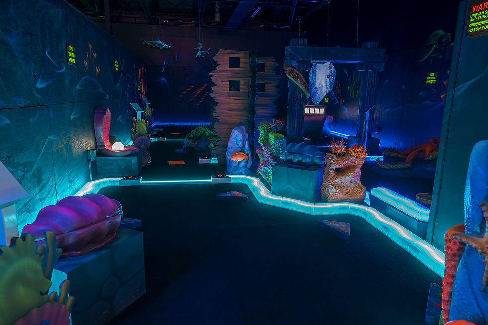 Immersive ruins-themed mini golf with eerie cave lighting and relics