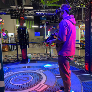 man playing virtual reality game at the fun lab