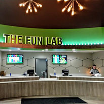 Modern front desk and lobby area at The Fun Lab in Blaine, MN