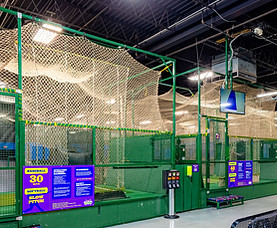 Batting cages and sports attractions at Grand Slam Family Fun Center