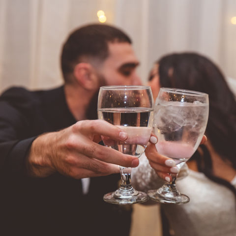 Couple Toasting at Bedford Event Center Wedding Reception