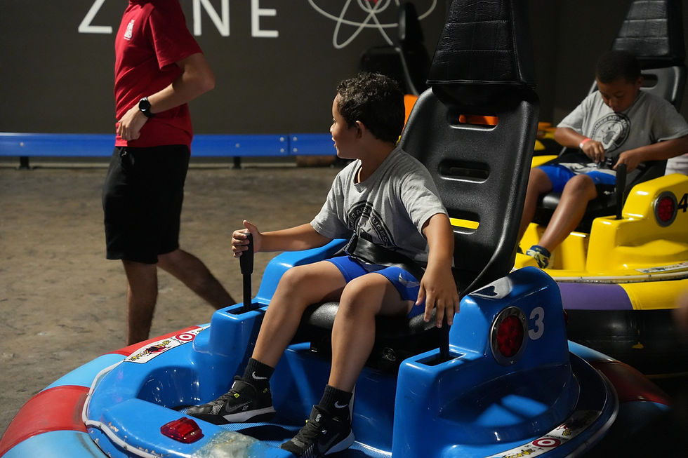 kids playing indoor bumper cars at the fun lab