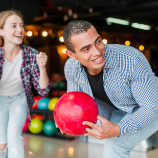 man and woman bowling 