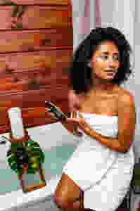 Model posing with Take Me Away Essentials products
