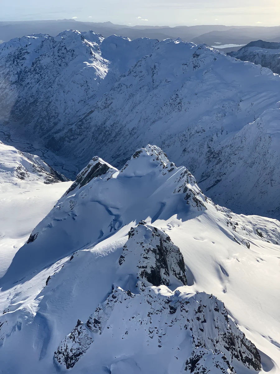 An aerial view of snow covered mountains on the South Island Of New Zealand