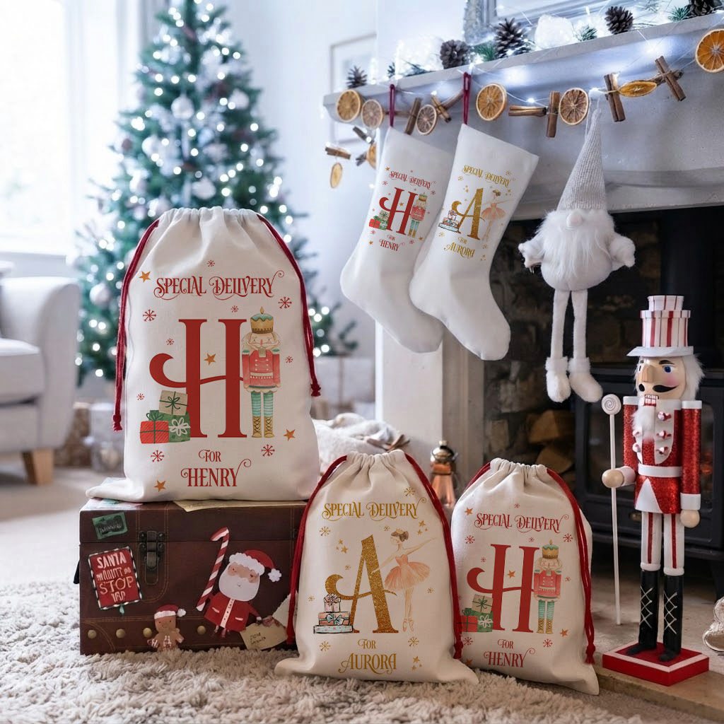 A Personalised Fairy Christmas Santa Sack displayed alongside matching holiday stockings and decor near a decorated Christmas