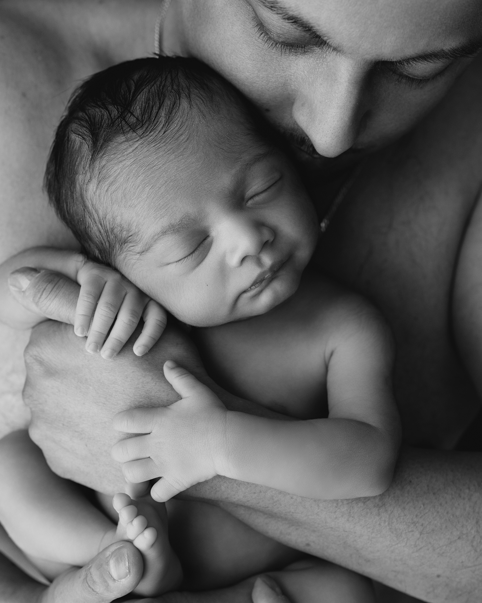 Newborn baby sleeping peacefully during professional photoshoot at Ongar studio by Essex newborn photographer Just Tina Photography