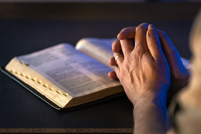 hands-holy-bible-prayer-open-bible-closeup-religion-concept.jpg