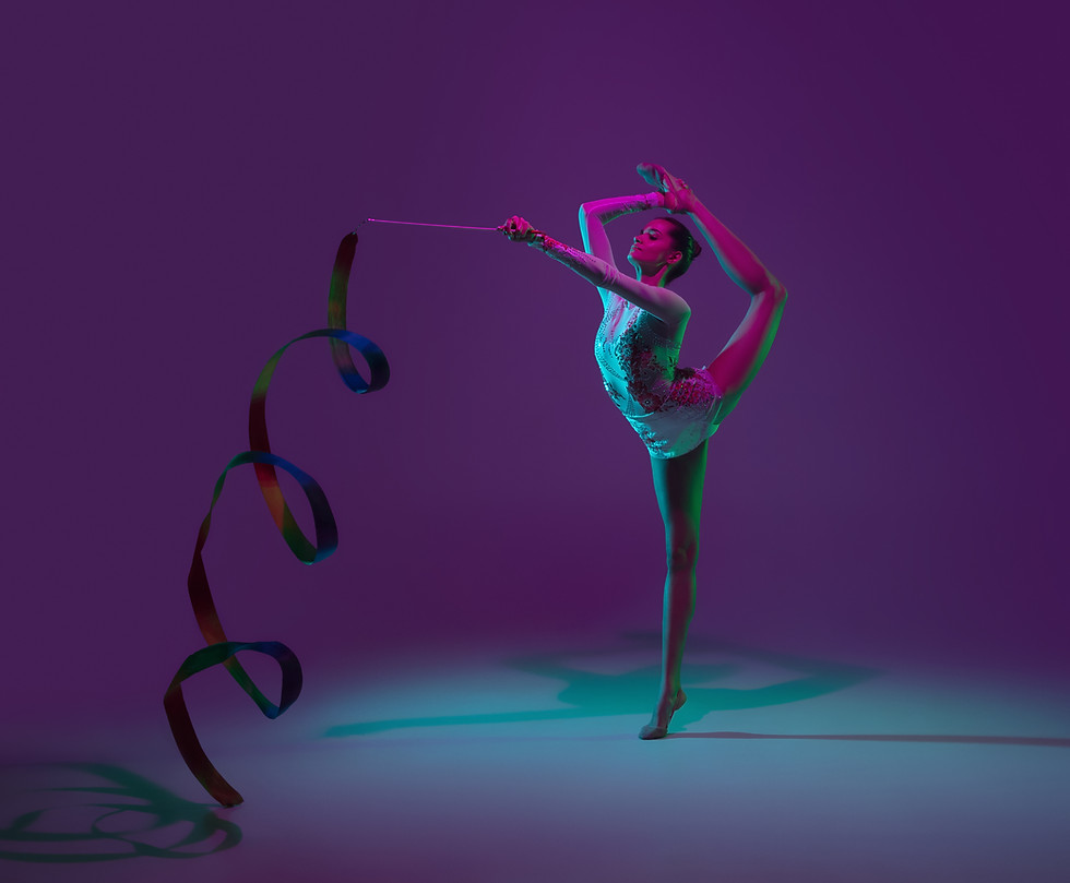 vibrant-young-female-athlete-rhythmic-gymnastics-artist-dancing-training-with-tape-isolate