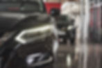 the-headlights-and-the-hood-of-a-black-luxury-car-2025-03-18-21-50-16-utc.jpg