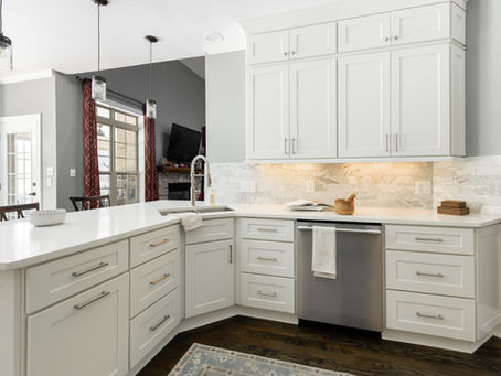 Newly renovated kitchen in Charlotte, NC with white shaker cabinets and quartz countertops