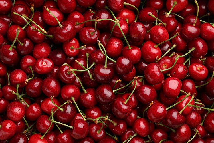 Fresh cherries covering the entire frame