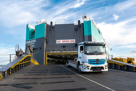 electric mercedes truck coming off a roll on roll off ship in Auckland New Zealand