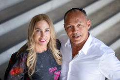 a professional couple portrait with strong diagonal lines in the background