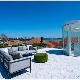 Photograph of a rooftop lounge deck in an upmarket  Airbnb