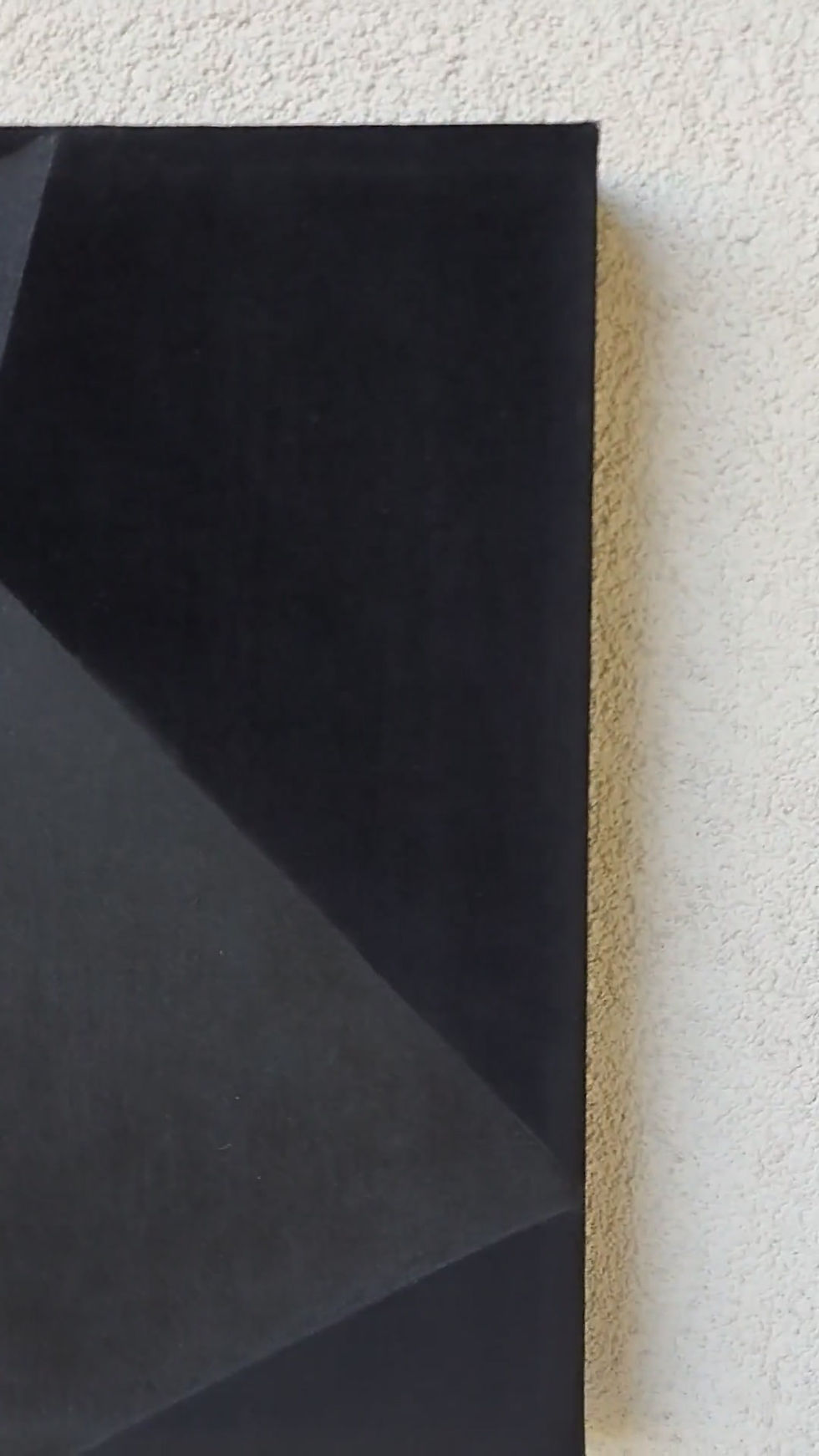 Thumbnail: Detail of multifaceted geometric plane contrasting with deep black velour background on Soft Form 3 by Bosiljka Zirojevic
