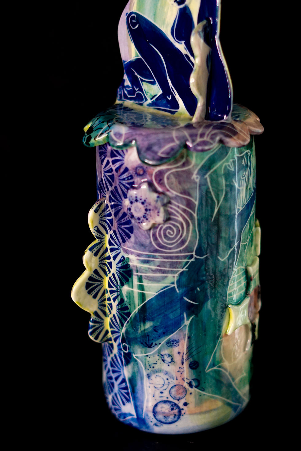 Thumbnail: Close-up of the glazed porcelain surface dark botanical transfers, fluid hand-etched sgraffito lines, green, blue and  purple