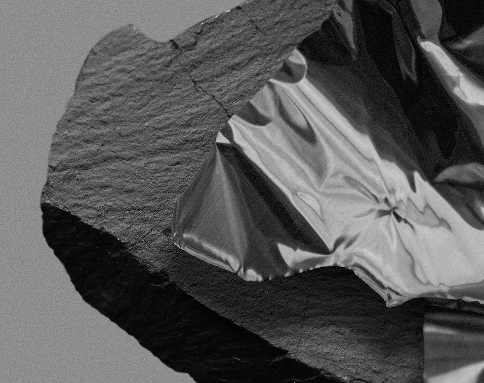 Thumbnail: There is a hand that protects me On Hansen Photography black and white abstract still life dark stone grey