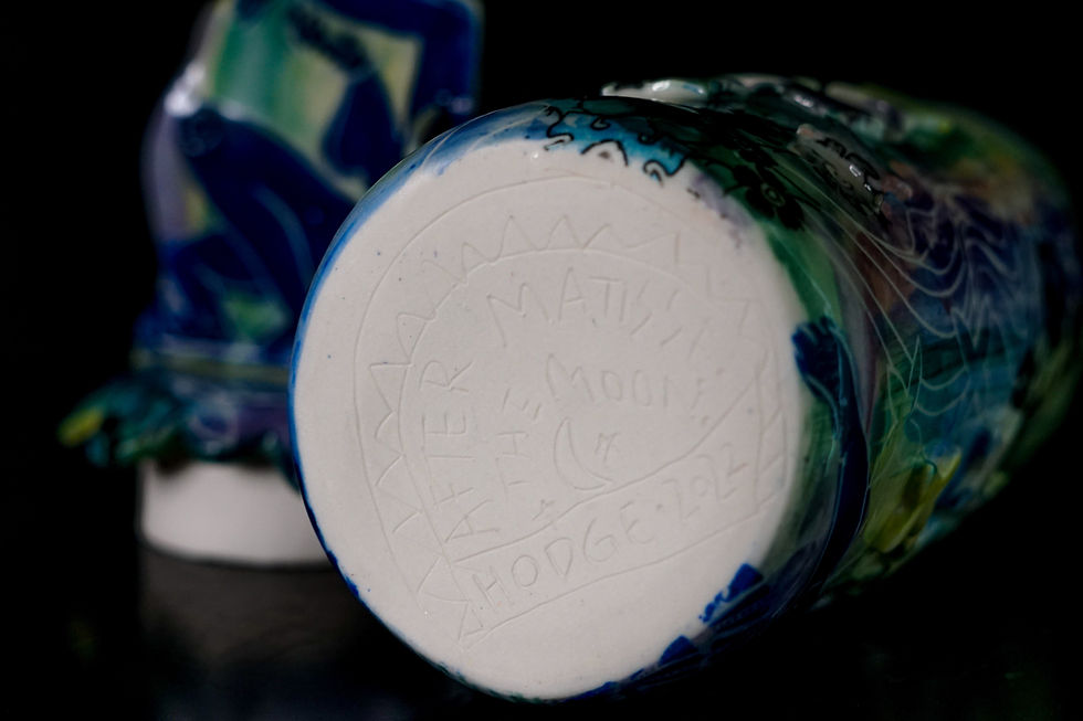 Thumbnail: Close-up of the glazed porcelain surface dark botanical transfers, fluid hand-etched sgraffito lines, green, blue and  purple