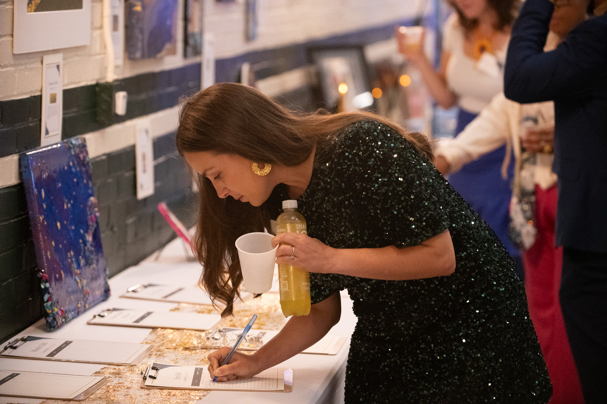 The image shows a silent auction for fundraising with bidding support.