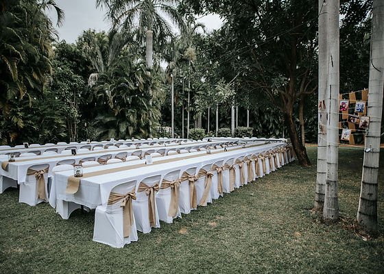 Wedding ceremony setup with chairs and tables under a tree in Kununurra, Kimberley event hire