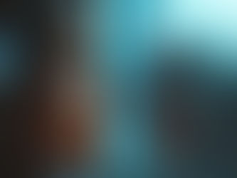 A young woman looks thoughtfully out of a window streaked with rain, her expression mirroring the gloomy atmosphere of the stormy day.