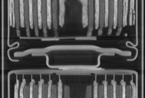 CT cross section x-ray of a rechargeable battery in series. The jelly roll and the anode and cathode are visible in cross section