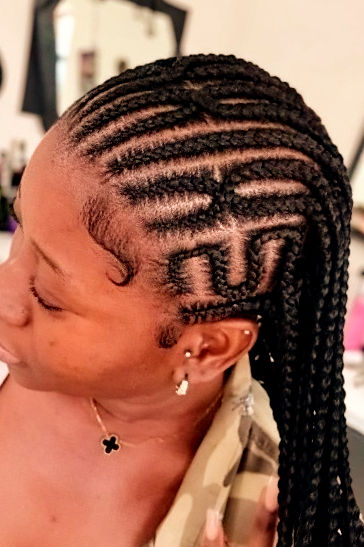 Feed-in cornrows with intricate geometric patterns