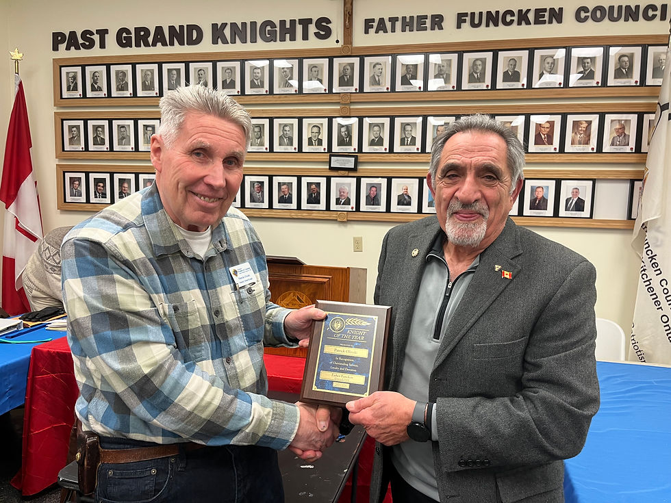Patrick Olinski accepts the Knight of the Year Award from GK Mario Peretti
