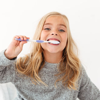 little girl with toothbrush