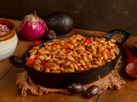 dish of baked beans on a table with ingredients