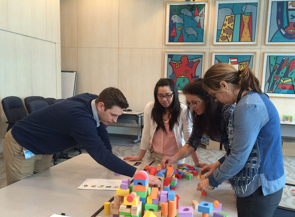 Team participating in a Stumbling Blocks team building seminar
