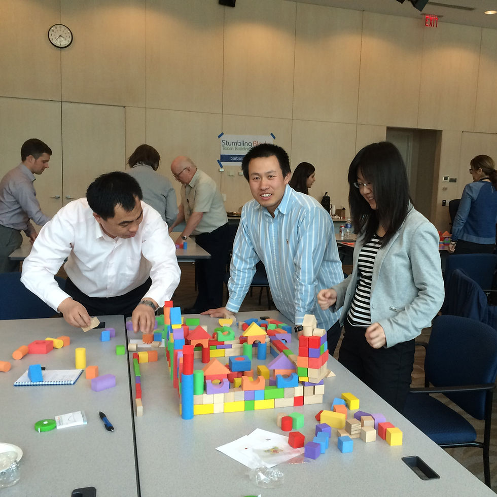 Workplace team collaborating during an interactive team building seminar