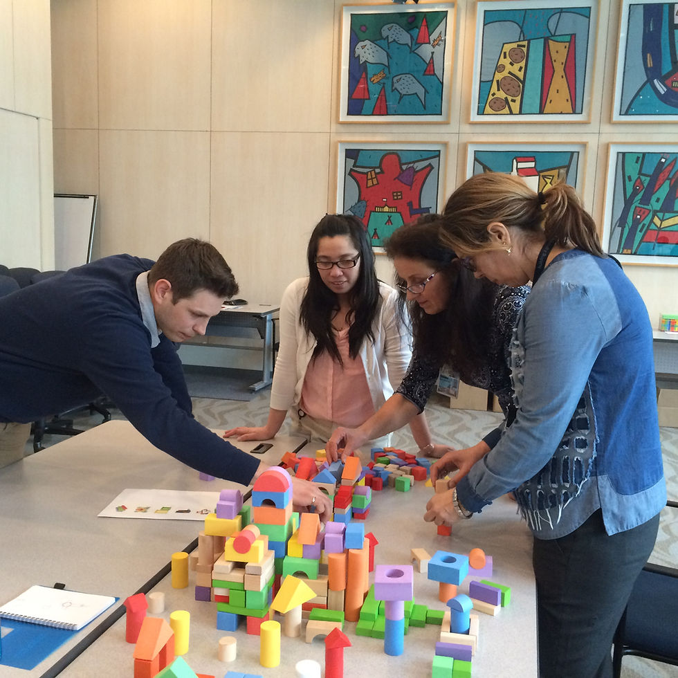 Team participating in a Stumbling Blocks team building seminar