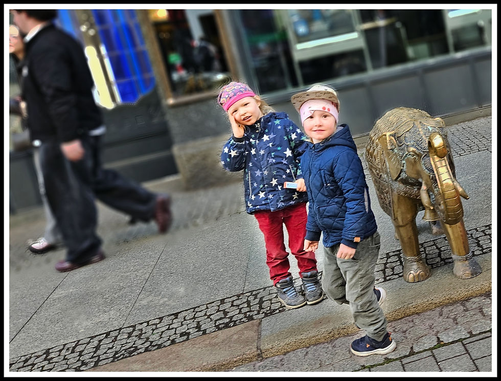 These two were having fun ringing the bell