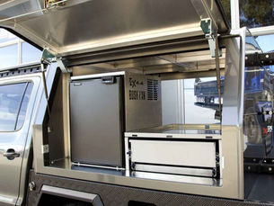 A custom canopy set up on the back of a dual cab 4WD with Bushman fridge.