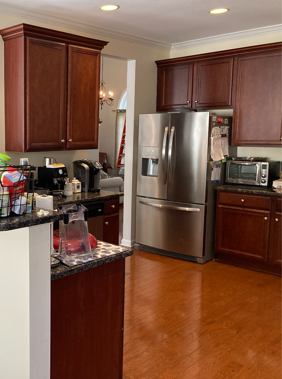 Kitchen with brown cabinets and a refrigerator