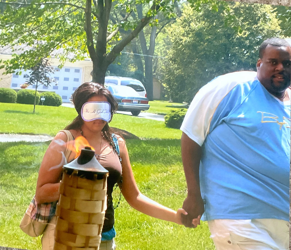 Daddy leading Jazmyne Danielle to a surprise 16th birthday luau.